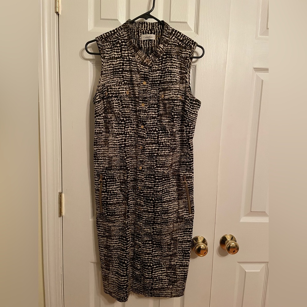 Calvin Klein sleeveless dress. Size 12, snap button front with pockets